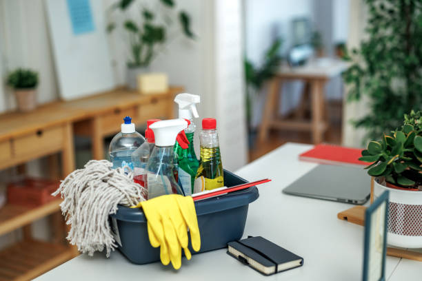 Cleaning products on table at small co working space with no people Cleaning products on table at small co working space with no people
