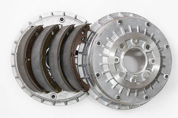 Brake shoes and drums on a white background Brake shoes and drums on a white background
